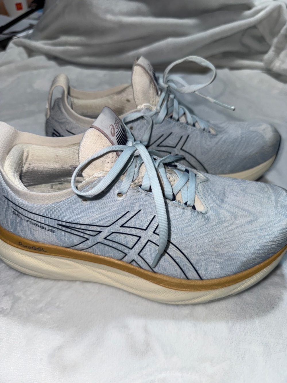 ASICS Women's Light Blue Athletic Running Shoes with Gold Accent